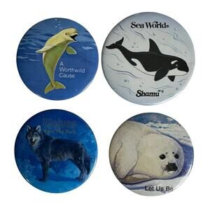 Vintage Lot of 4 Sea World Wildlife Pins Buttons Wolf Seal Beluga Shamu